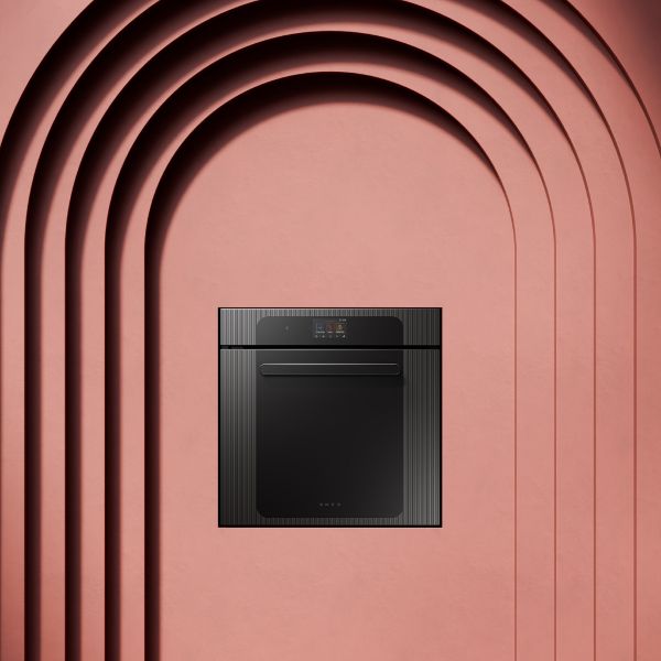 SMEG built-in oven with black glass front and electronic controls, shown against a decorative architectural background.